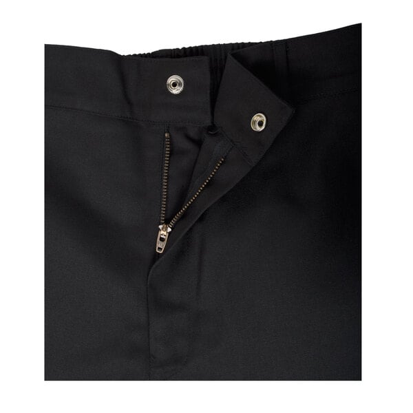 A close up of black Chef Revival chef trousers with a zipper.