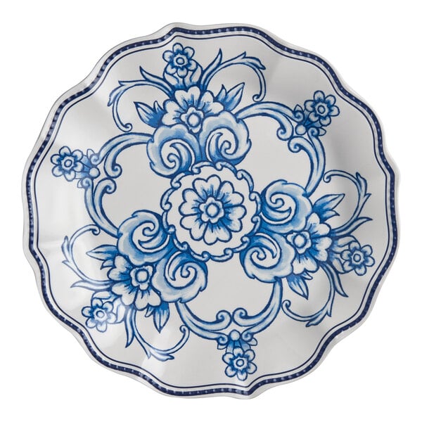 An American Metalcraft Isabella melamine plate with a blue and white floral design on a scalloped rim.