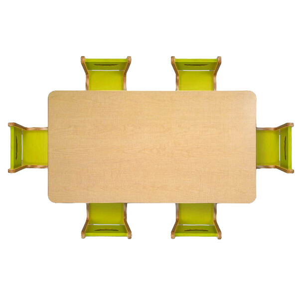A Whitney Brothers rectangular wood children's table with green chairs.