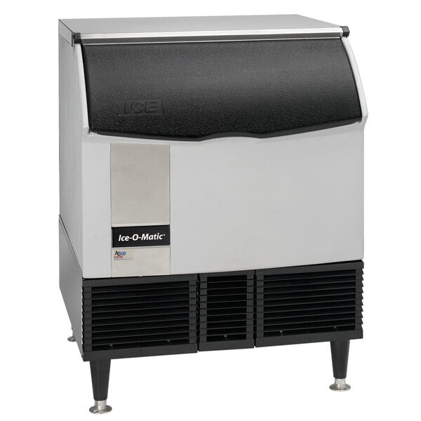 An Ice-O-Matic undercounter ice machine with black and silver trim.