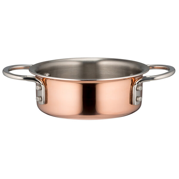 A Bon Chef copper mini pot with a handle.