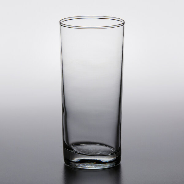 a clear glass with a white cap