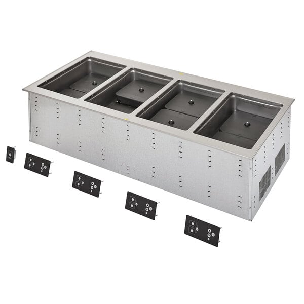 A stainless steel Vollrath drop-in hot food well with four rectangular containers.