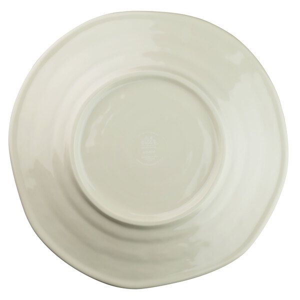 A white plate with a round rim and beach design on it.