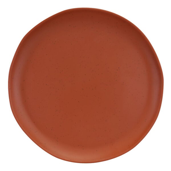 A close-up of an Elite Global Solutions round matte sunburn terra cotta speckled melamine plate.
