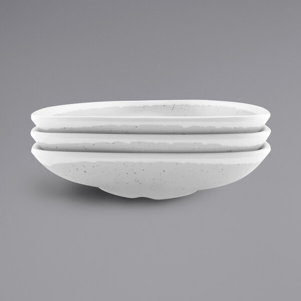 a stack of white bowls