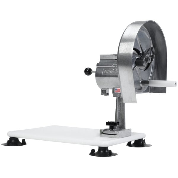 A silver circular metal Nemco Easy Slicer on a white surface.