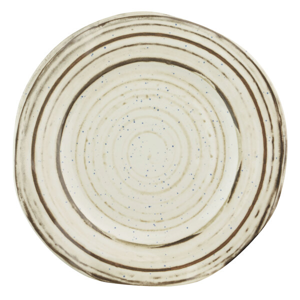 A close-up of a white Elite Global Solutions melamine plate with a beach design featuring a white and blue speckled surface.