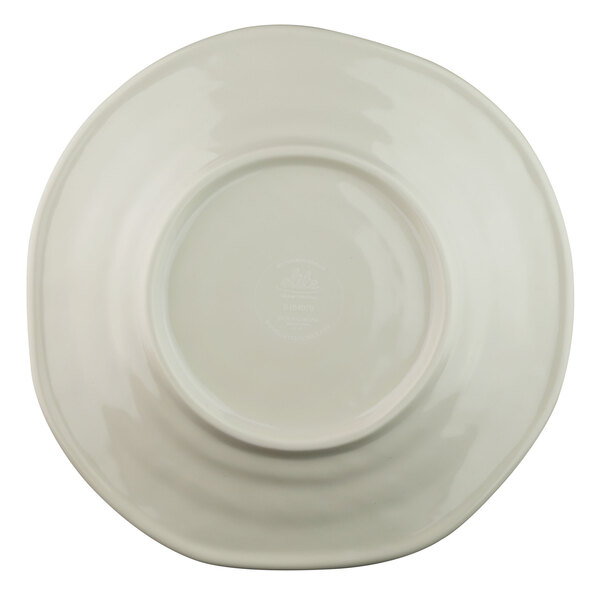 A white plate with a round rim.