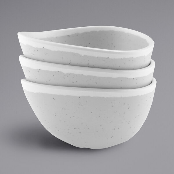 A stack of gray speckled melamine bowls.