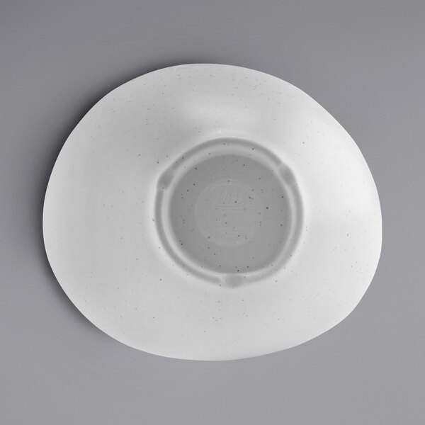 A white bowl with a gray speckled center.