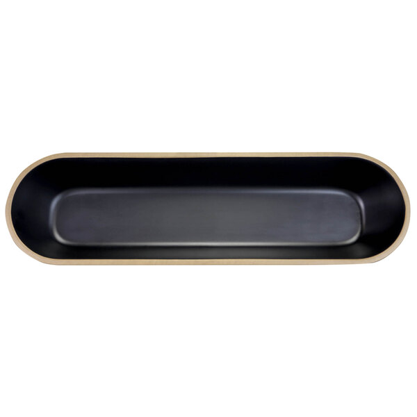 An oval black melamine bowl with a gold edge.