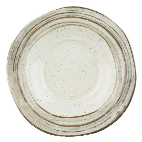 An Elite Global Solutions Doheny melamine bowl with a beach design featuring a white bowl with brown specks.