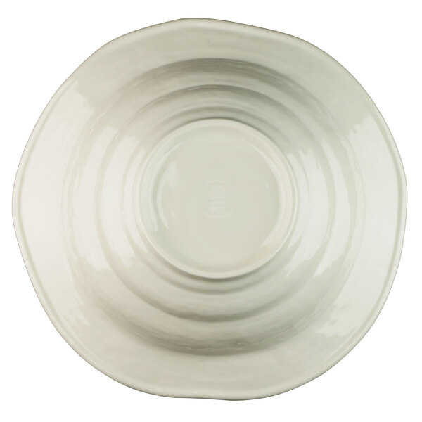 A white melamine bowl with a beach design in the middle.