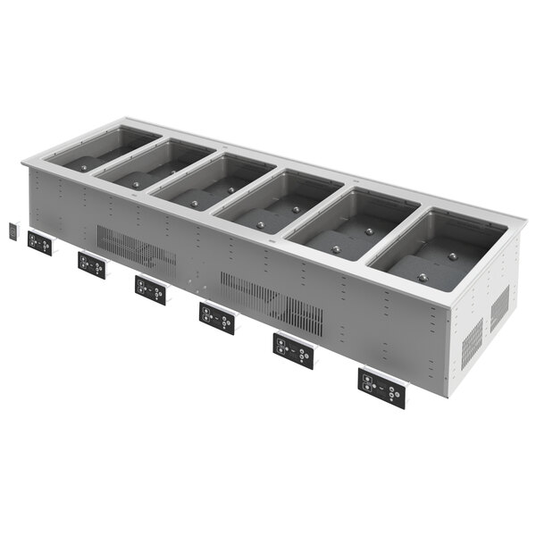 A white rectangular Vollrath drop-in hot food well with six compartments.