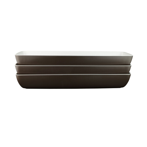 A rectangular white melamine bowl with a grey and white speckled interior.