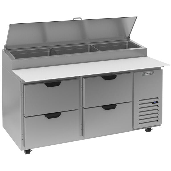 A Beverage-Air stainless steel pizza prep table with 4 drawers.