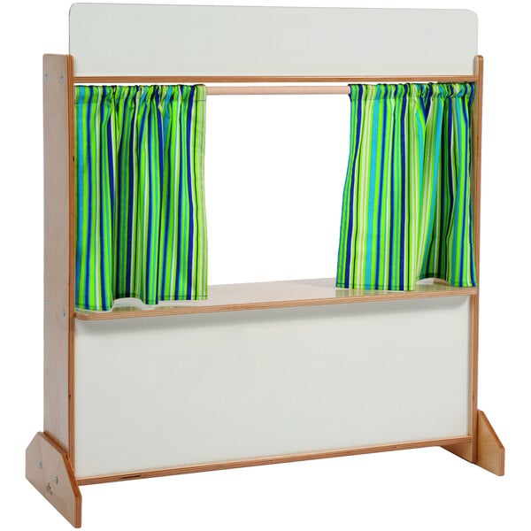 A Whitney Brothers wooden puppet theater with striped curtains on a wooden stand.