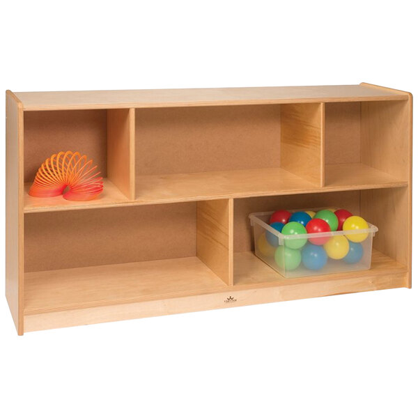 A Whitney Brothers wooden storage cabinet with plastic bins full of balls on a shelf.