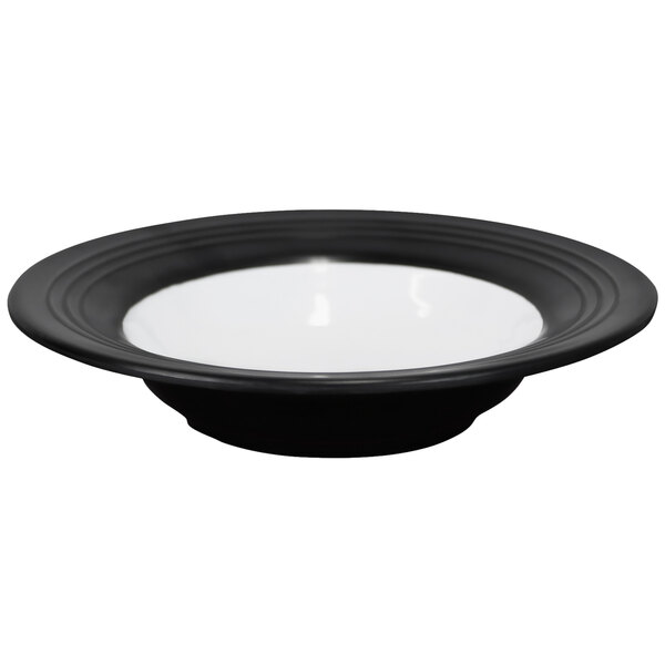 A black melamine bowl with a white rim.