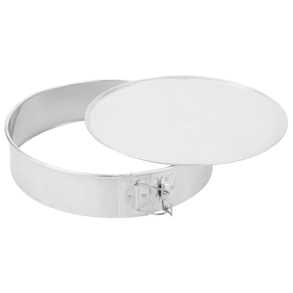 A round metal cake pan with a lid.