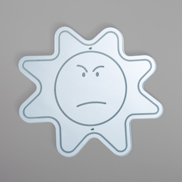 A white drawing of a sun with a sad face.