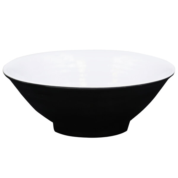 A black melamine bowl with a white rim.