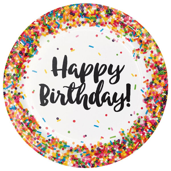 A white paper plate with sprinkles and the words "Happy Birthday" on it.