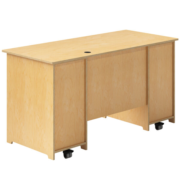 A Whitney Brothers wooden mobile teacher's desk with wheels.