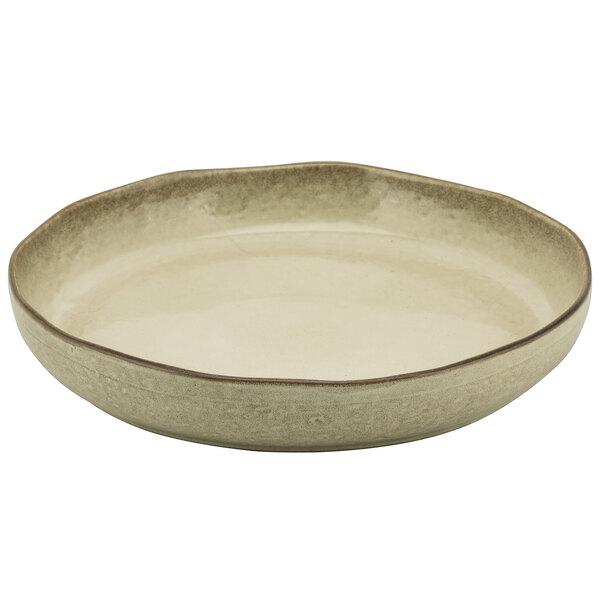 A white porcelain deep plate with a brown rim.