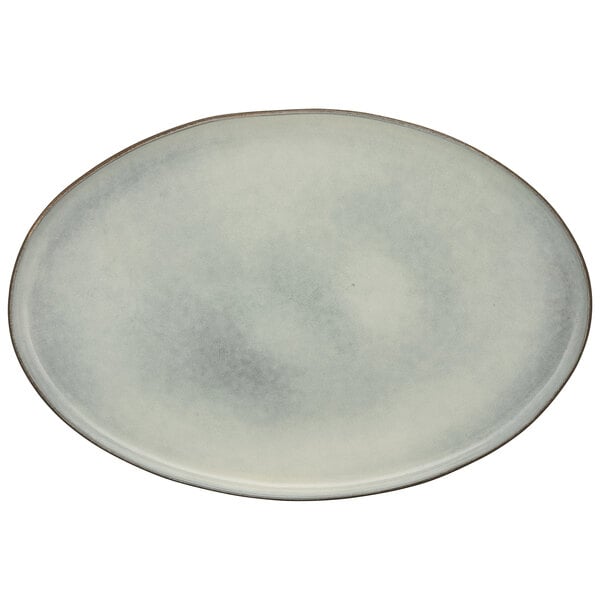 A white porcelain oval platter with a blue border.