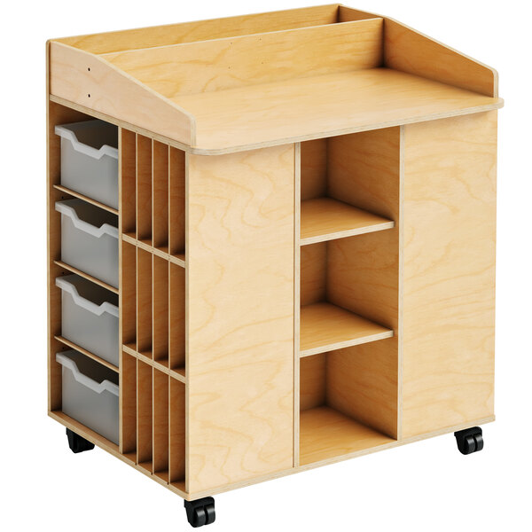 A Whitney Brothers wooden mobile communication station with shelves and bins.