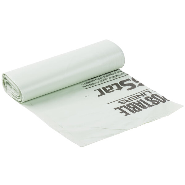 A roll of green BioStar compostable trash can liners with the words "60 Gallon" on it.