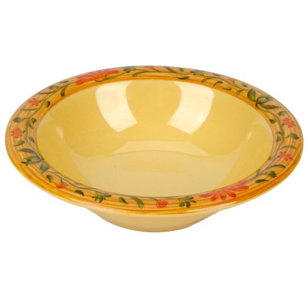 A yellow Venetian bowl with a floral design.