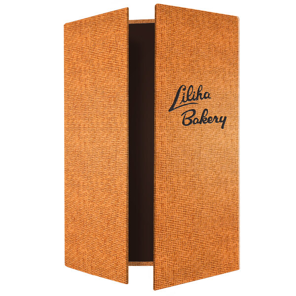 A brown Wicker gatefold menu cover with black text on the corners.