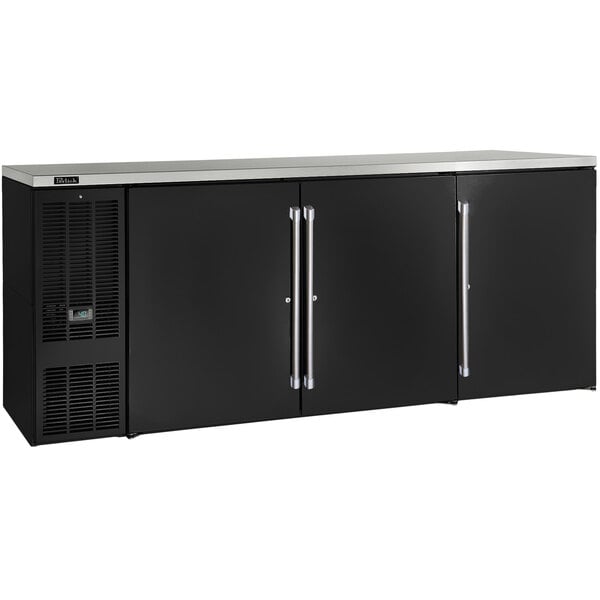 A black Perlick pass-thru back bar refrigerator with silver handles.