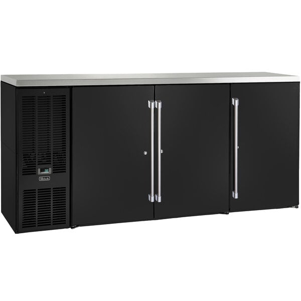 A black Perlick back bar refrigerator with silver handles on two narrow doors.