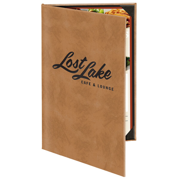 A brown leather Menu Solutions menu cover with the words "Lost Lake Restaurant" on the cover on a table.