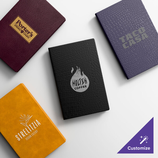 A collection of four customizable faux leather menu covers in various colors and textures, each featuring different business logos on the front.