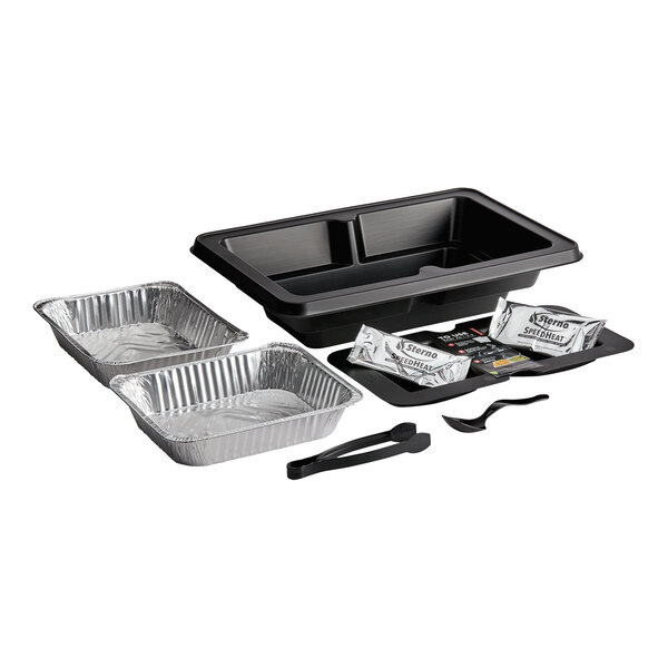 A set of buffet food warming system components, including two aluminum trays, a black plastic base with two compartments, two heat packs, a black tray, and serving utensils.