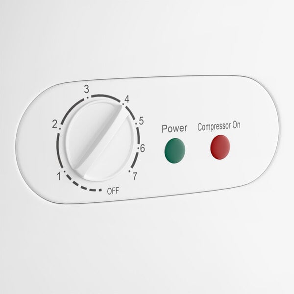 A control panel of a commercial chest freezer with a temperature dial and indicator lights for power and compressor status.