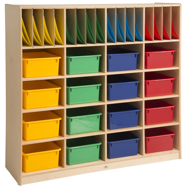 A Whitney Brothers wooden classroom storage unit with colorful bins.