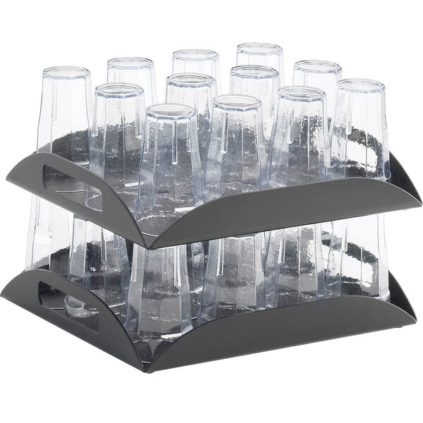 A black Cal-Mil coffee amenity tray with clear cups on it.