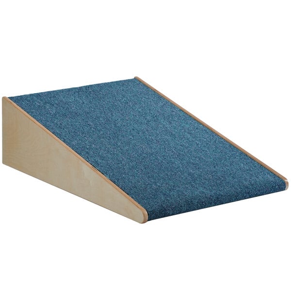 A blue carpeted Whitney Brothers Woodscapes ramp with a wooden base.