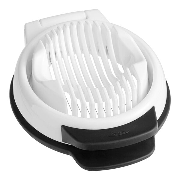 A white and black plastic OXO egg slicer.