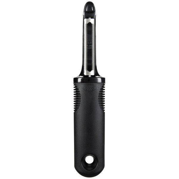 An OXO Good Grips peeler with a black handle and a silver blade.