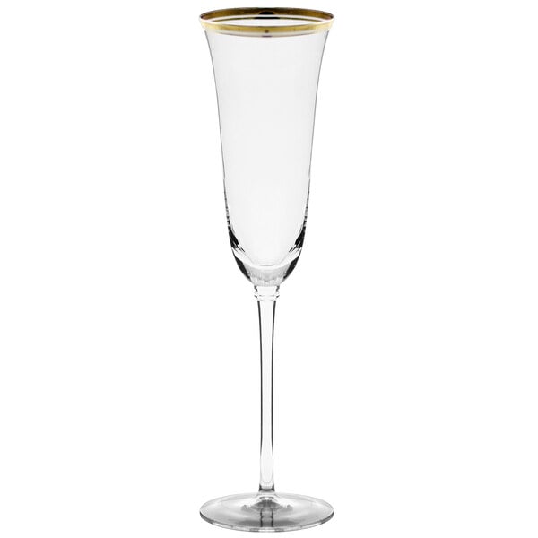 A clear wine glass with a stem and gold rim.