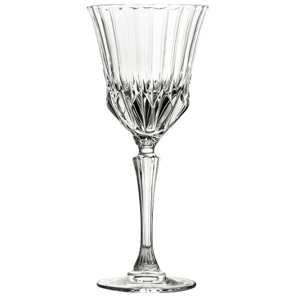 A clear wine glass with a long stem.