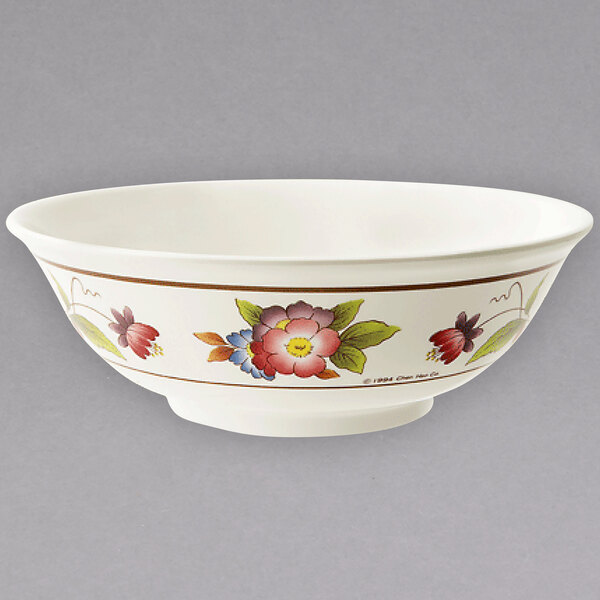 a white bowl with flowers on it