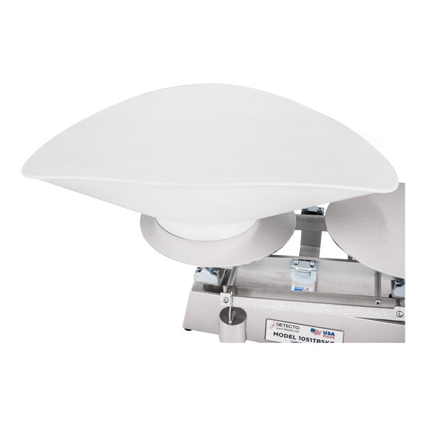 A white, curved plastic scoop attached to a metal scale base.